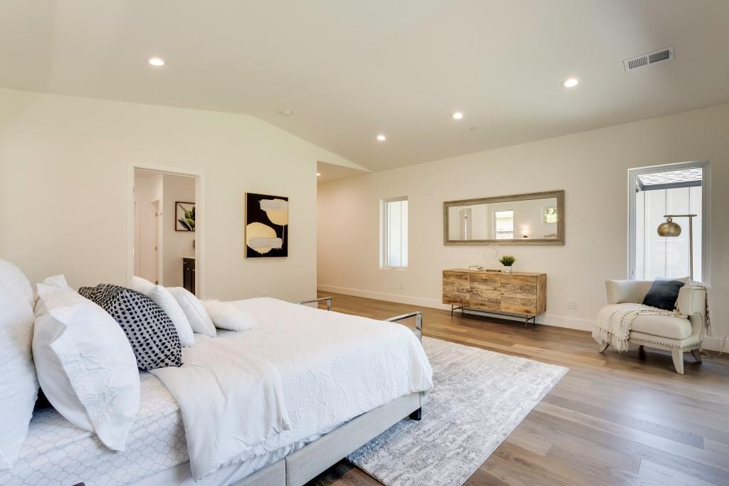 1057 Covington Road Los Altos, CA 94024 - Photo 14 of 31 a spacious bedroom with a bed and a couch