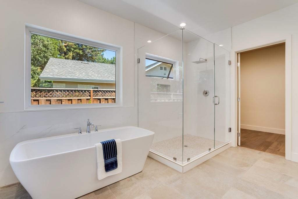 1057 Covington Road Los Altos, CA 94024 - Photo 15 of 31 a bathroom with a tub a window and a shower