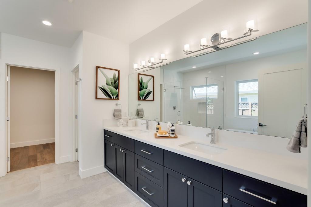1057 Covington Road Los Altos, CA 94024 - Photo 16 of 31 a bathroom with a double vanity sink and a mirror