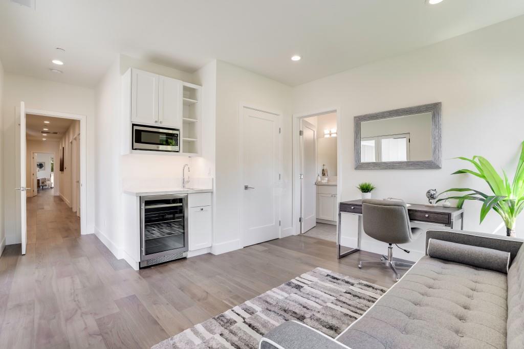 1057 Covington Road Los Altos, CA 94024 - Photo 20 of 31 a living room with furniture a fireplace and a table