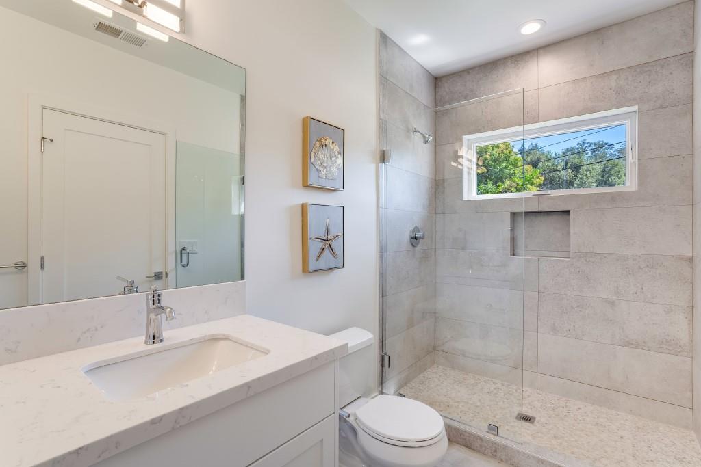 1057 Covington Road Los Altos, CA 94024 - Photo 22 of 31 a bathroom with a sink a toilet and shower