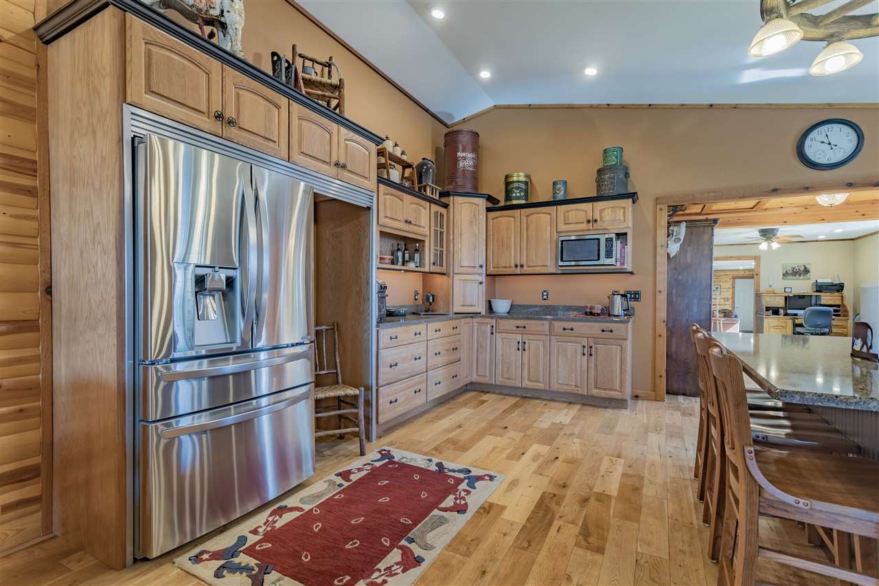 3517 North Marrill Road Byron, IL 61010 - Photo 13 of 36 a kitchen with stainless steel appliances granite countertop a refrigerator and a stove