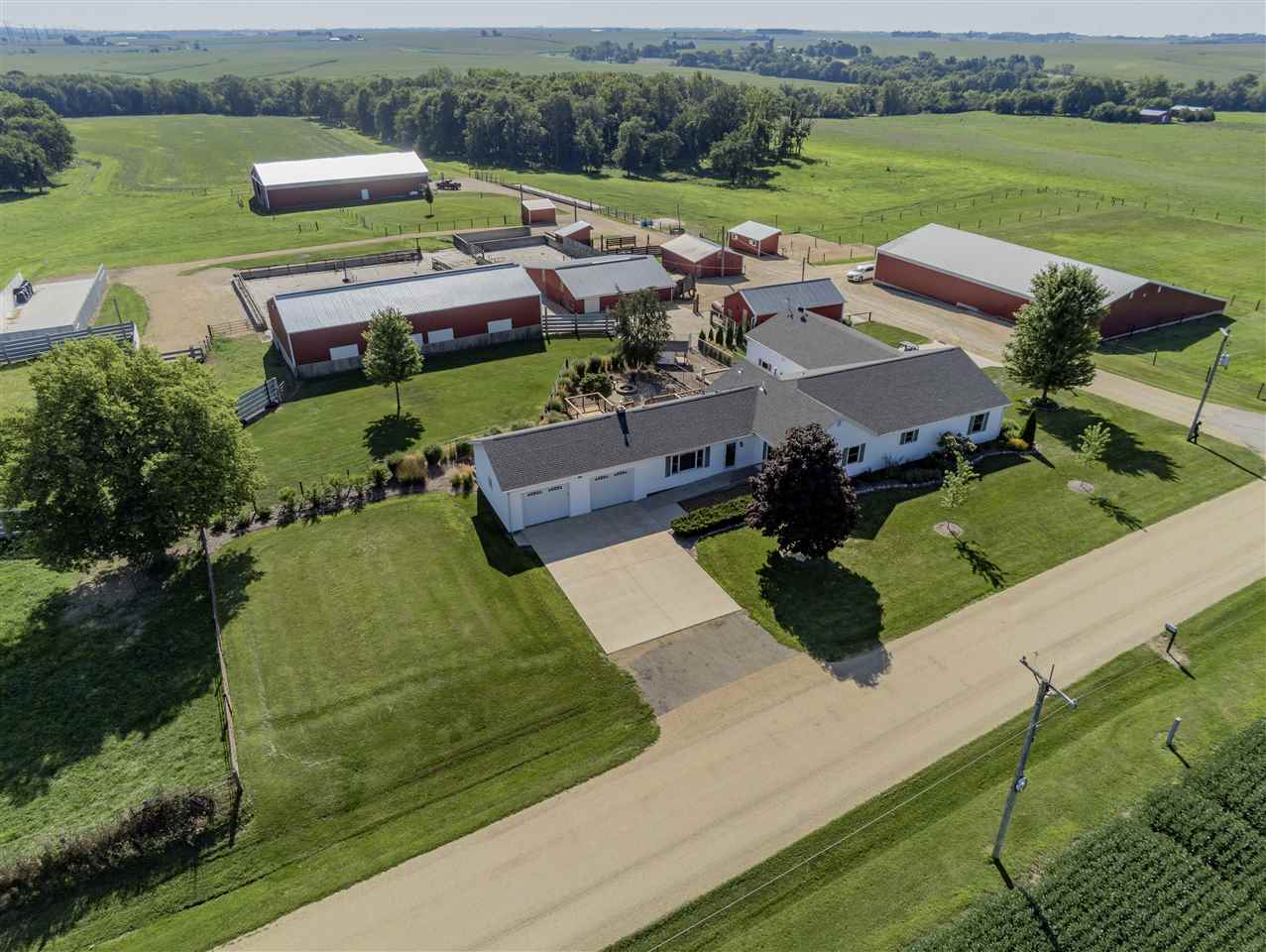 3517 North Marrill Road Byron, IL 61010 - Photo 6 of 36 an aerial view of a house with outdoor space lake view and large trees