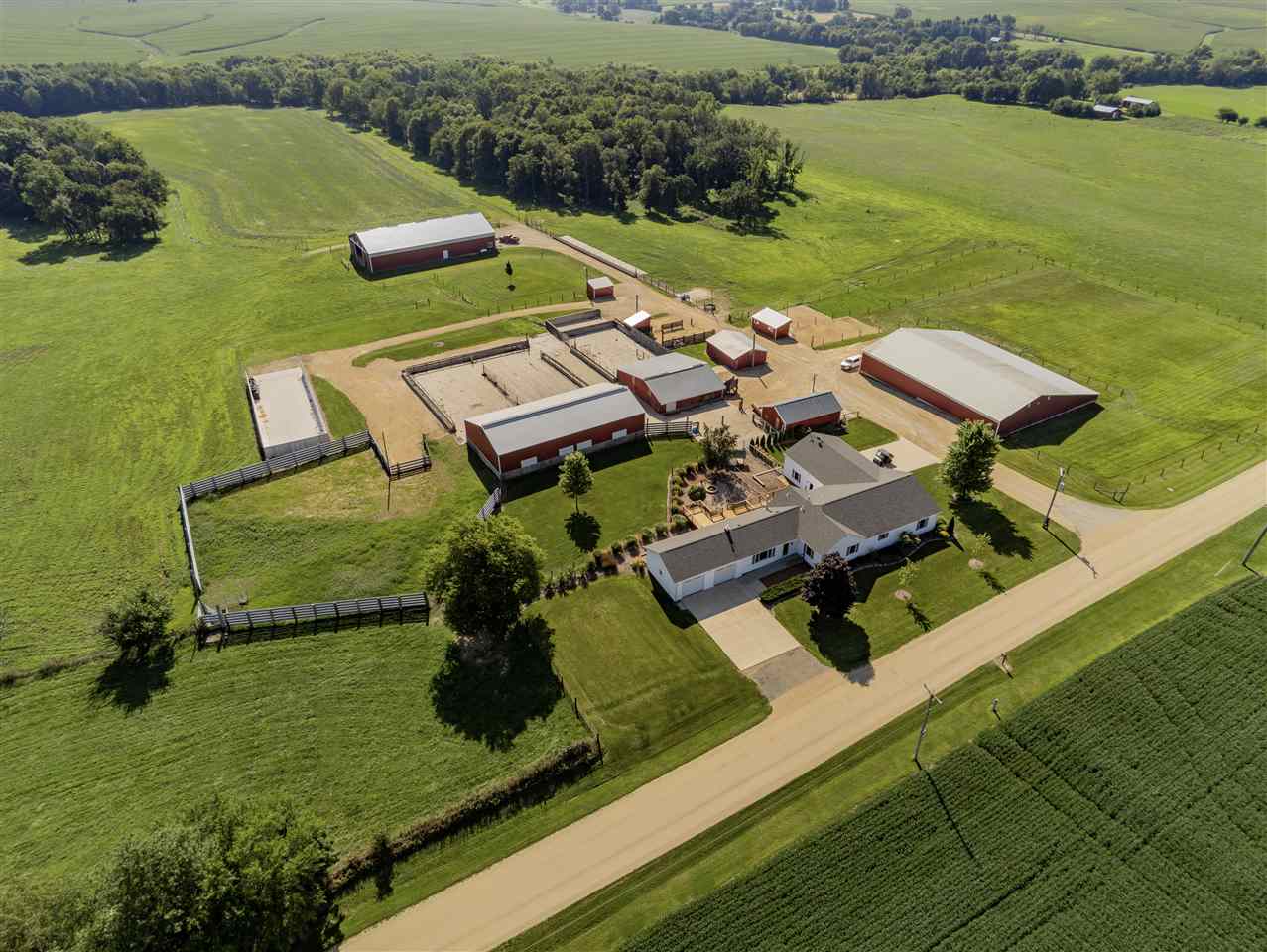 3517 North Marrill Road Byron, IL 61010 - Photo 7 of 36 an aerial view of a house with a garden and lake view