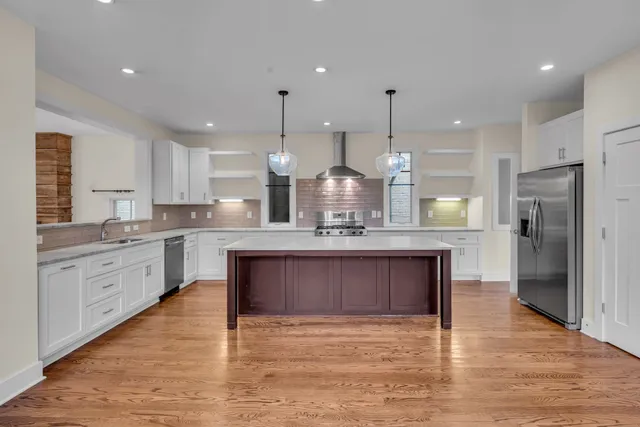 a kitchen with a sink and refrigerator