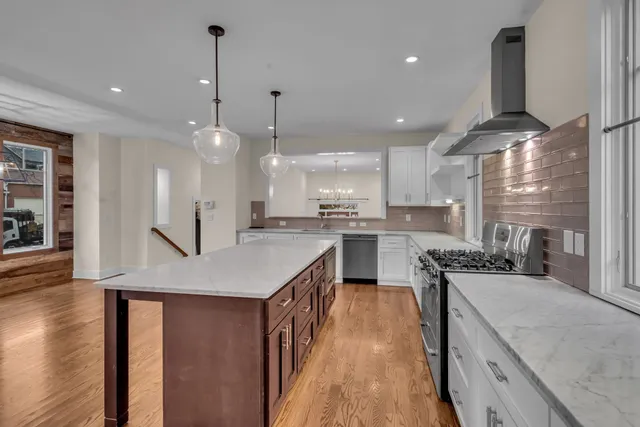 a view of a hallway with windows