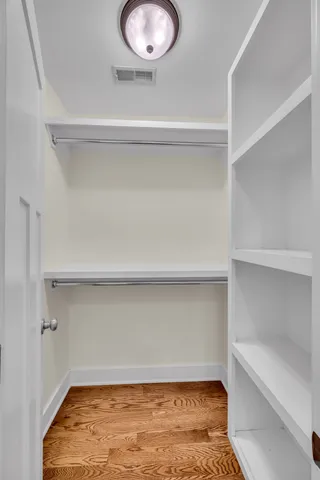 a view of a storage and utility room with washer and dryer