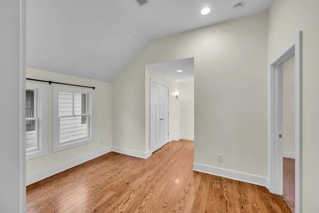 a view of walk in closet with empty racks
