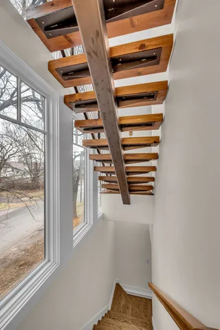a view of a house with a wooden fence