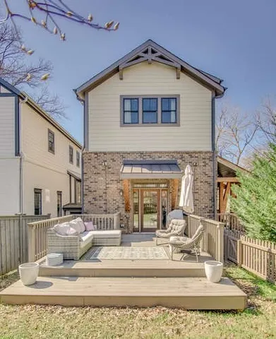 a front view of a house with wooden stairs