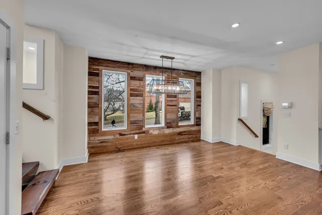 a large kitchen with a center island and stainless steel appliances