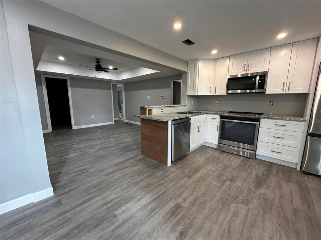 2301 Trelain Drive South St. Petersburg, FL 33712 - Photo 2 of 16 a kitchen with a sink and steel appliances