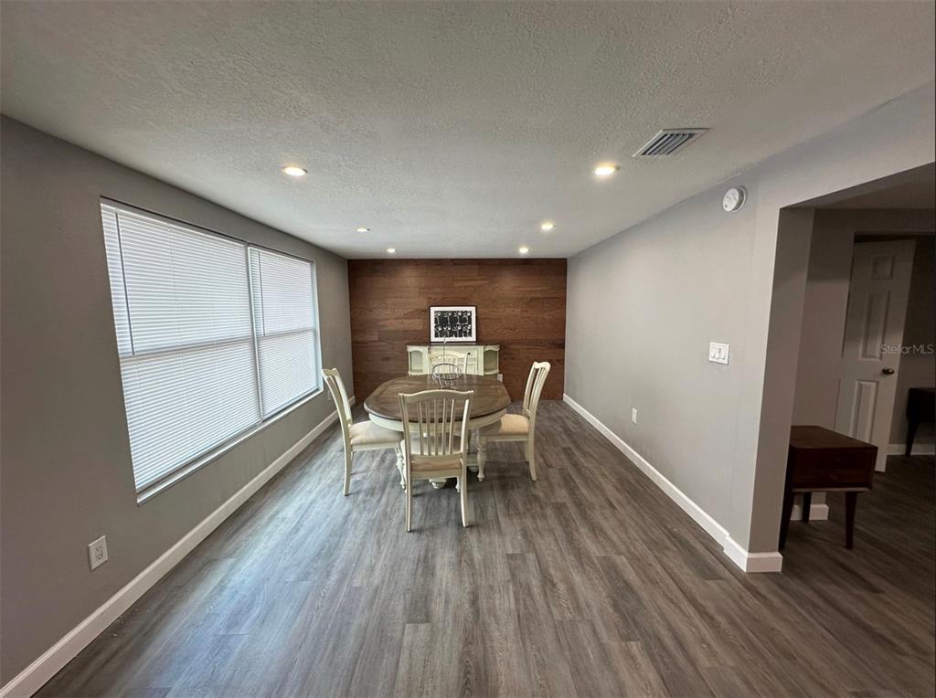 2301 Trelain Drive South St. Petersburg, FL 33712 - Photo 6 of 16 a dining room with furniture and wooden floor