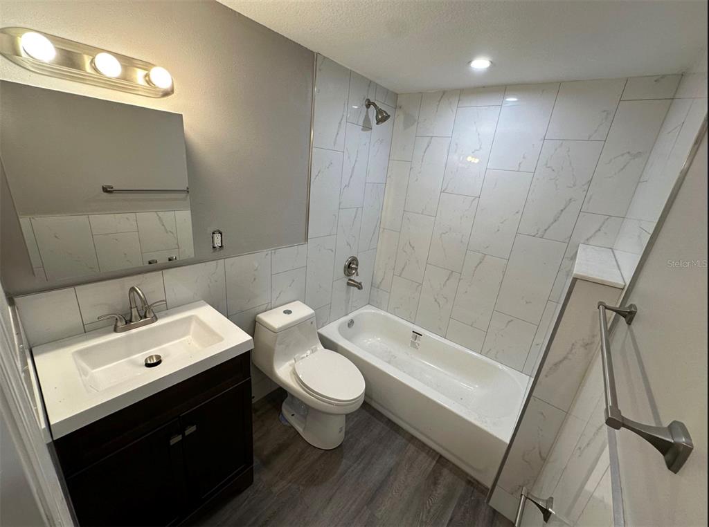 2301 Trelain Drive South St. Petersburg, FL 33712 - Photo 10 of 16 a bathroom with a sink a toilet and shower
