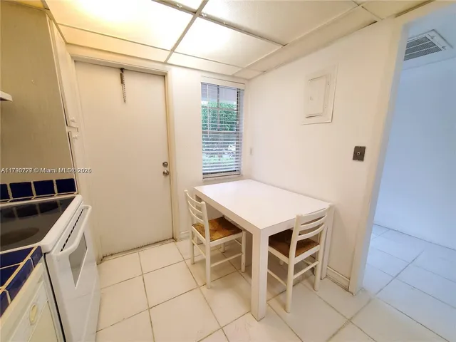 a bathroom with a double vanity sink toilet and mirror