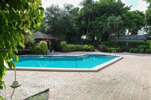 a view of a swimming pool with a patio