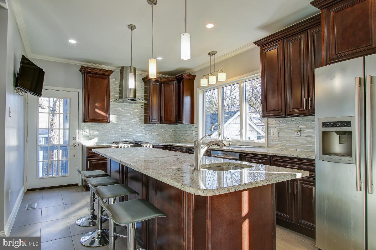 3921 Ingomar Street Northwest Washington, DC 20015 - Photo 11 of 33 Island allows for four stool seating.