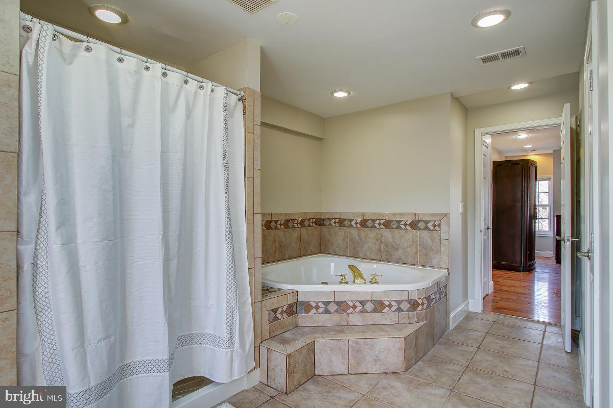 3921 Ingomar Street Northwest Washington, DC 20015 - Photo 27 of 33 Soaking Tub and Separate Shower in Master Bath.