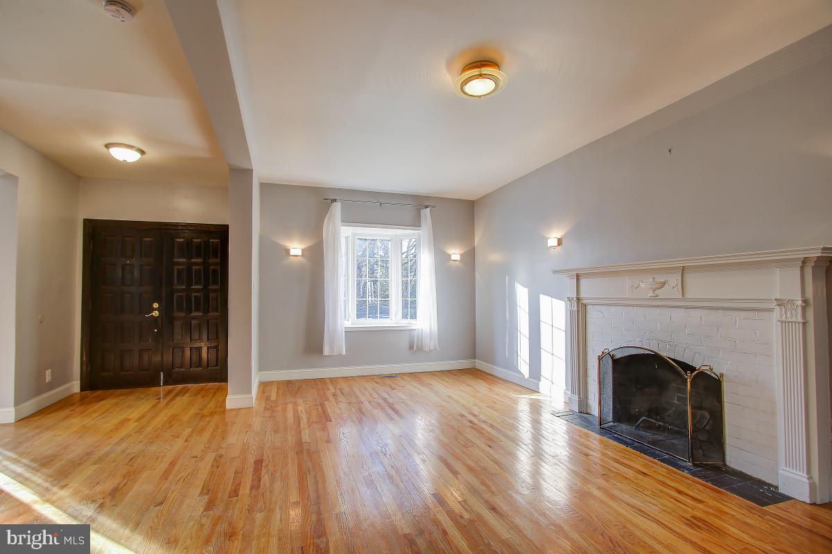 3921 Ingomar Street Northwest Washington, DC 20015 - Photo 5 of 33 Living Room with Bay Window and Wood Burning FP