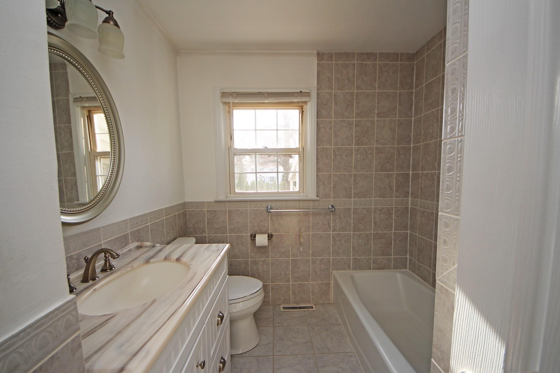 68 Maple Street Darien, CT 06820 - Photo 12 of 25 a bathroom with a sink a toilet and bathtub