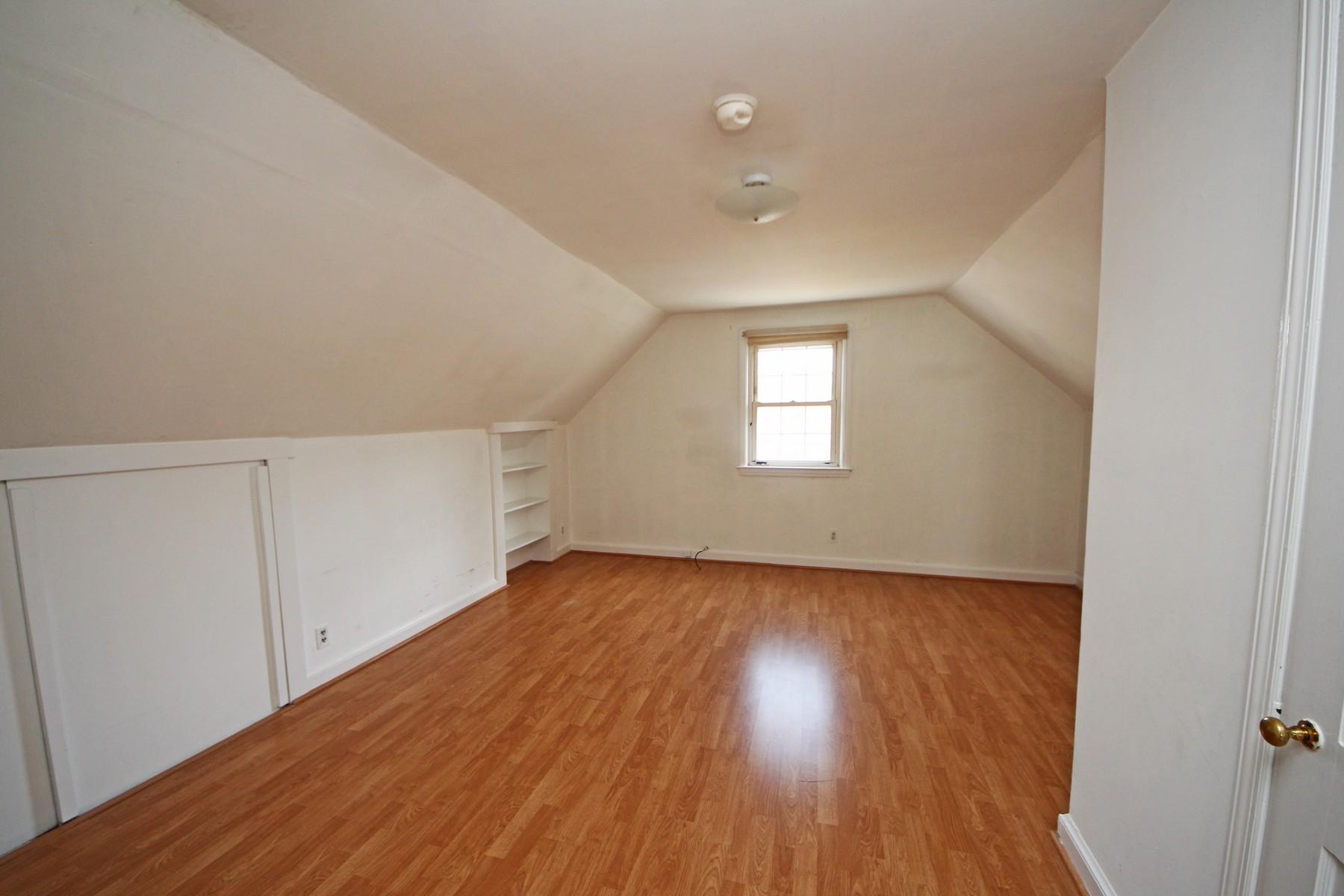 68 Maple Street Darien, CT 06820 - Photo 17 of 25 an empty room with wooden floor and windows