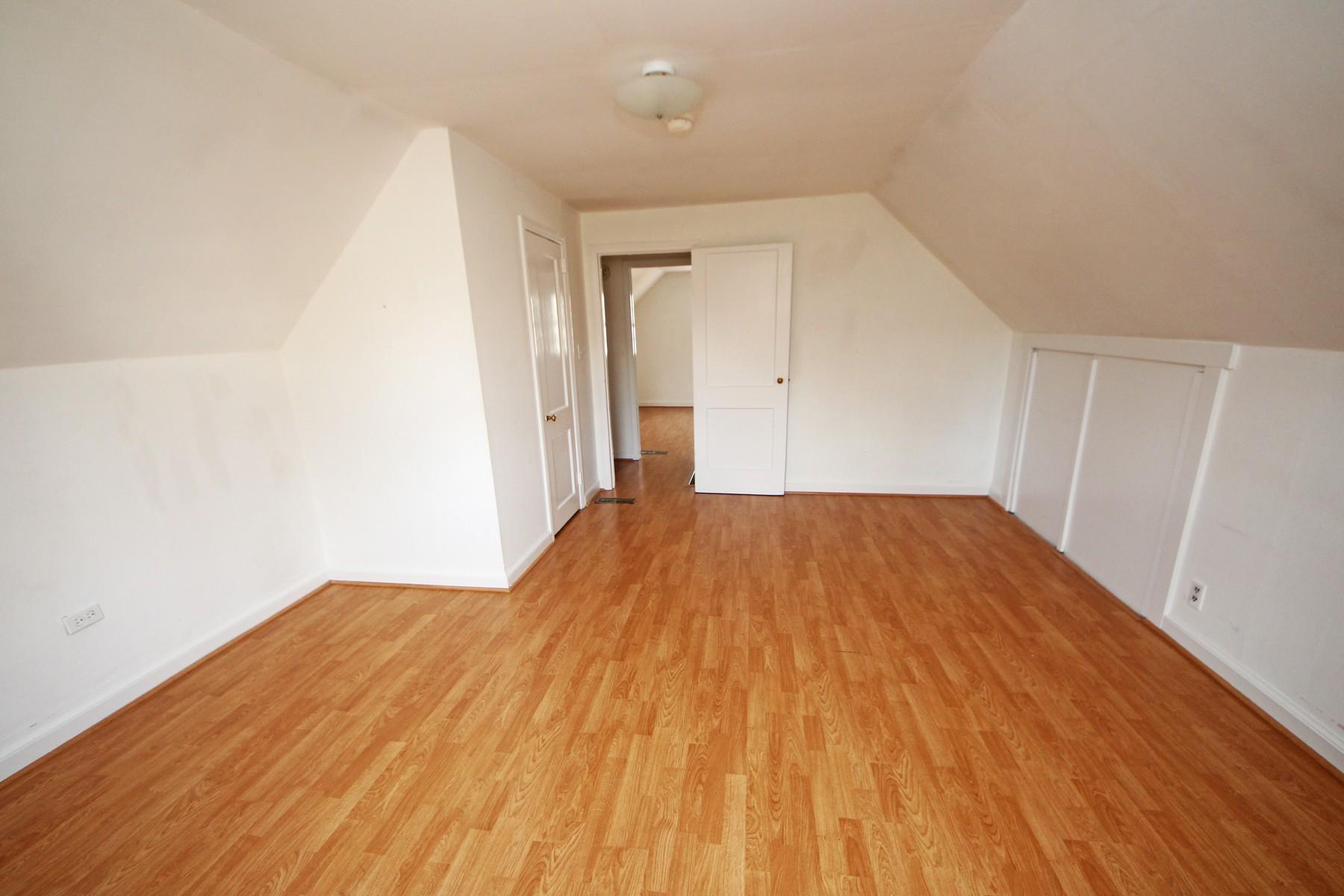 68 Maple Street Darien, CT 06820 - Photo 19 of 25 a big room with wooden floor and natural light