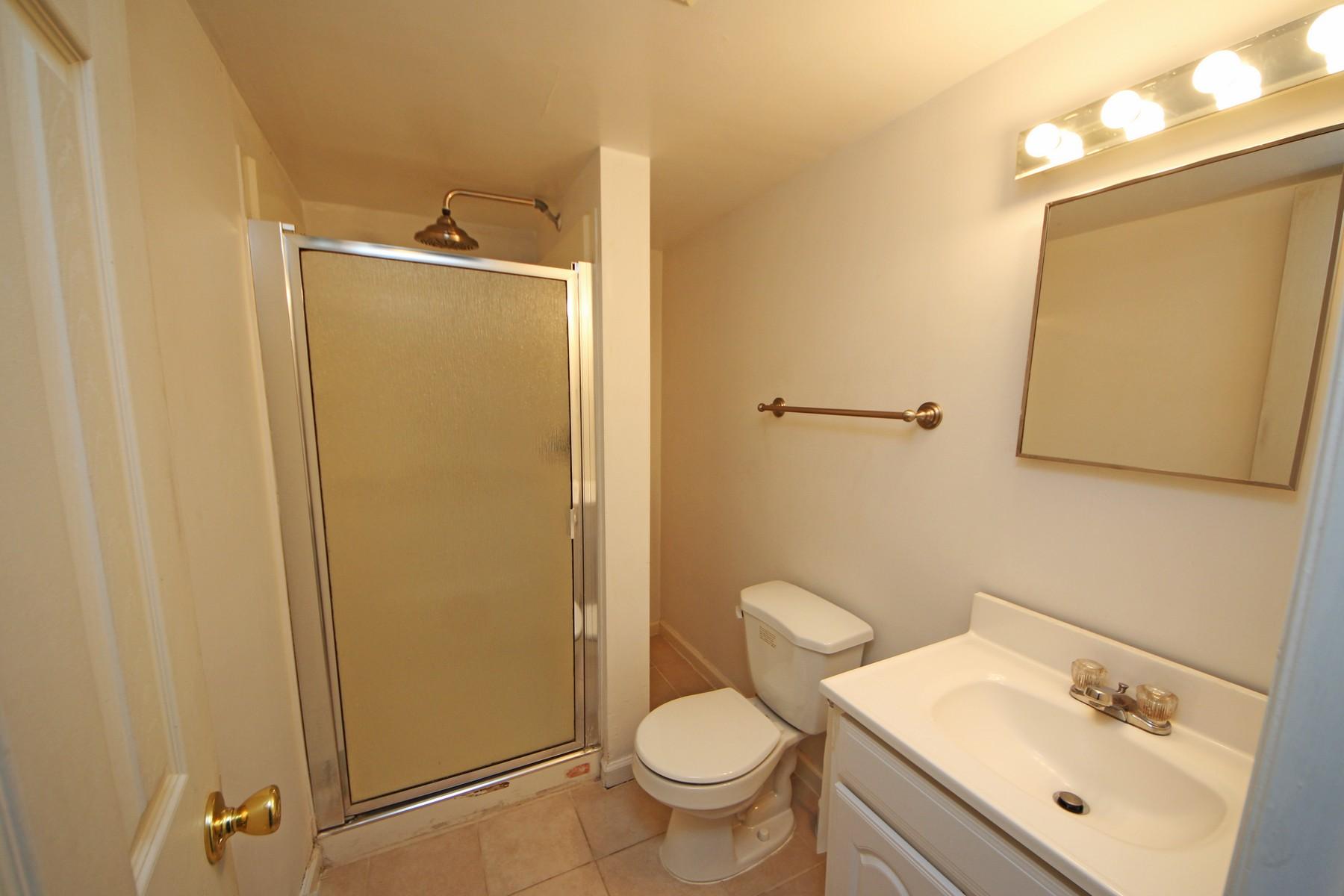 68 Maple Street Darien, CT 06820 - Photo 20 of 25 a bathroom with a sink toilet and shower