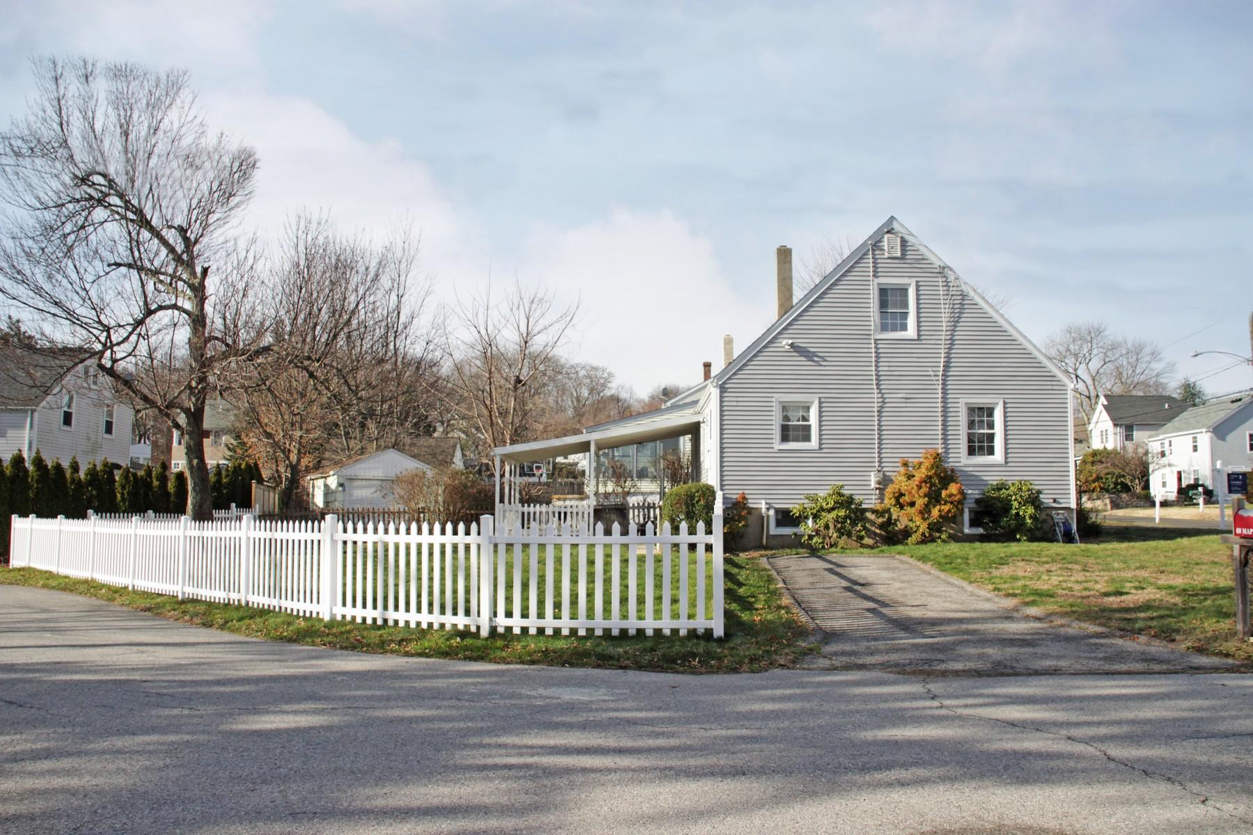 68 Maple Street Darien, CT 06820 - Photo 22 of 25 a front view of a house with a small yard
