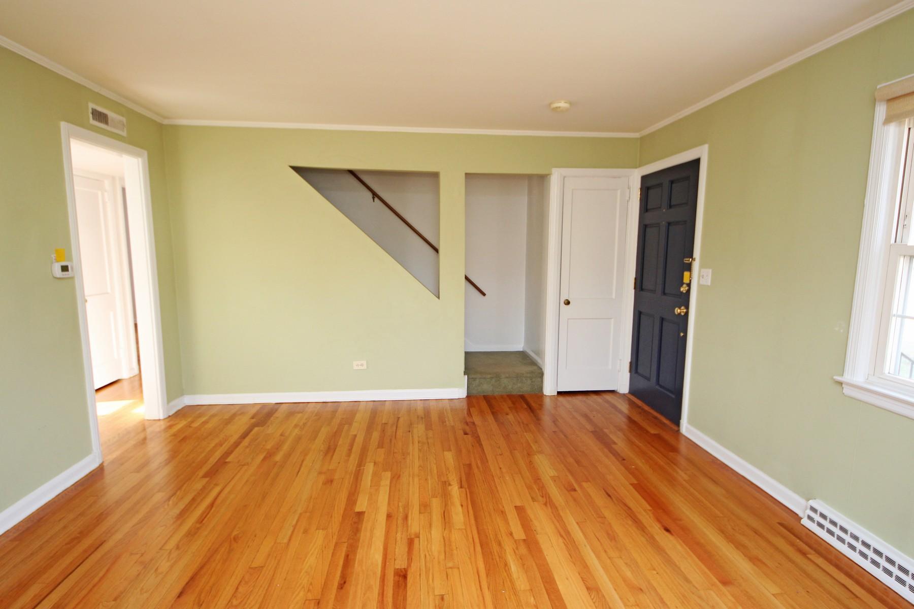 68 Maple Street Darien, CT 06820 - Photo 5 of 25 a view of an empty room with wooden floor and a window