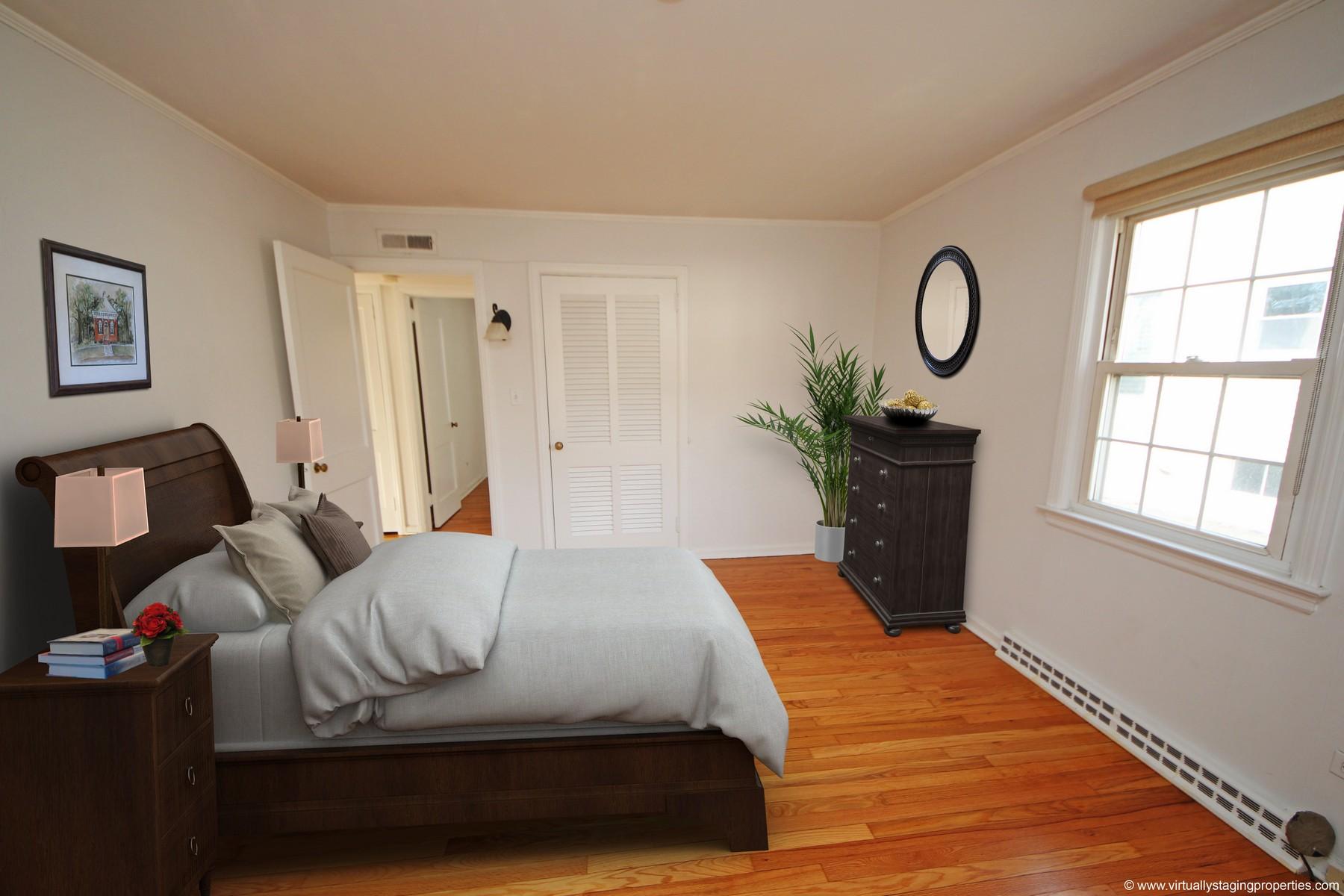 68 Maple Street Darien, CT 06820 - Photo 9 of 25 a bedroom with a bed and a window
