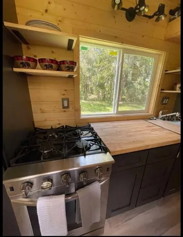 a close view of a stove top oven sitting inside of a kitchen