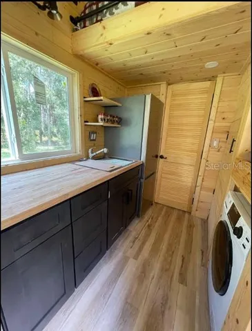 a bathroom with a sink a mirror and shower