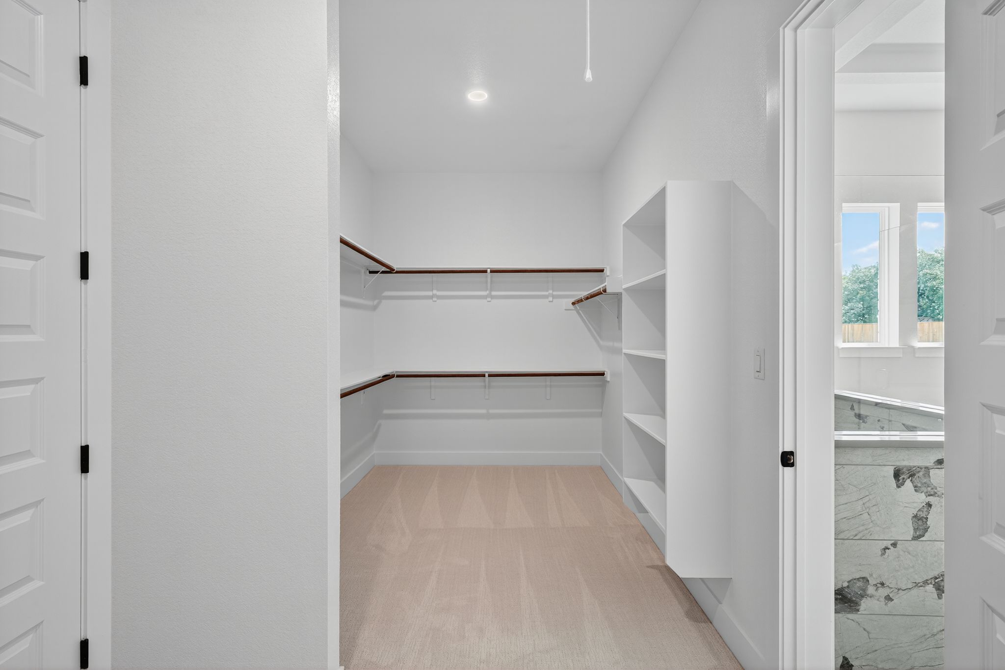 205 Three Rivers Road Georgetown, TX 78633 - Photo 15 of 32 a view of walk in closet with empty racks