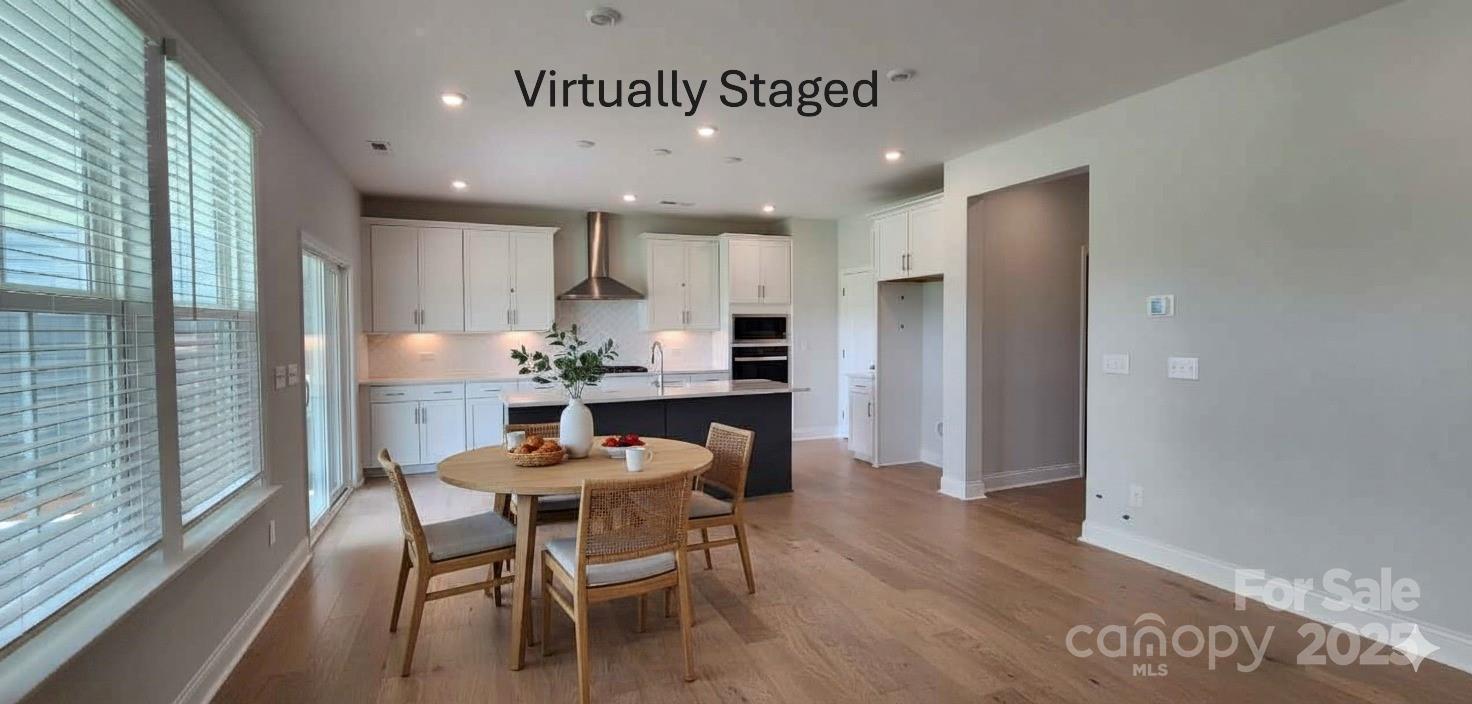 885 Regulus Court York, SC 29745 - Photo 11 of 46 a view of a dining room with furniture and wooden floor