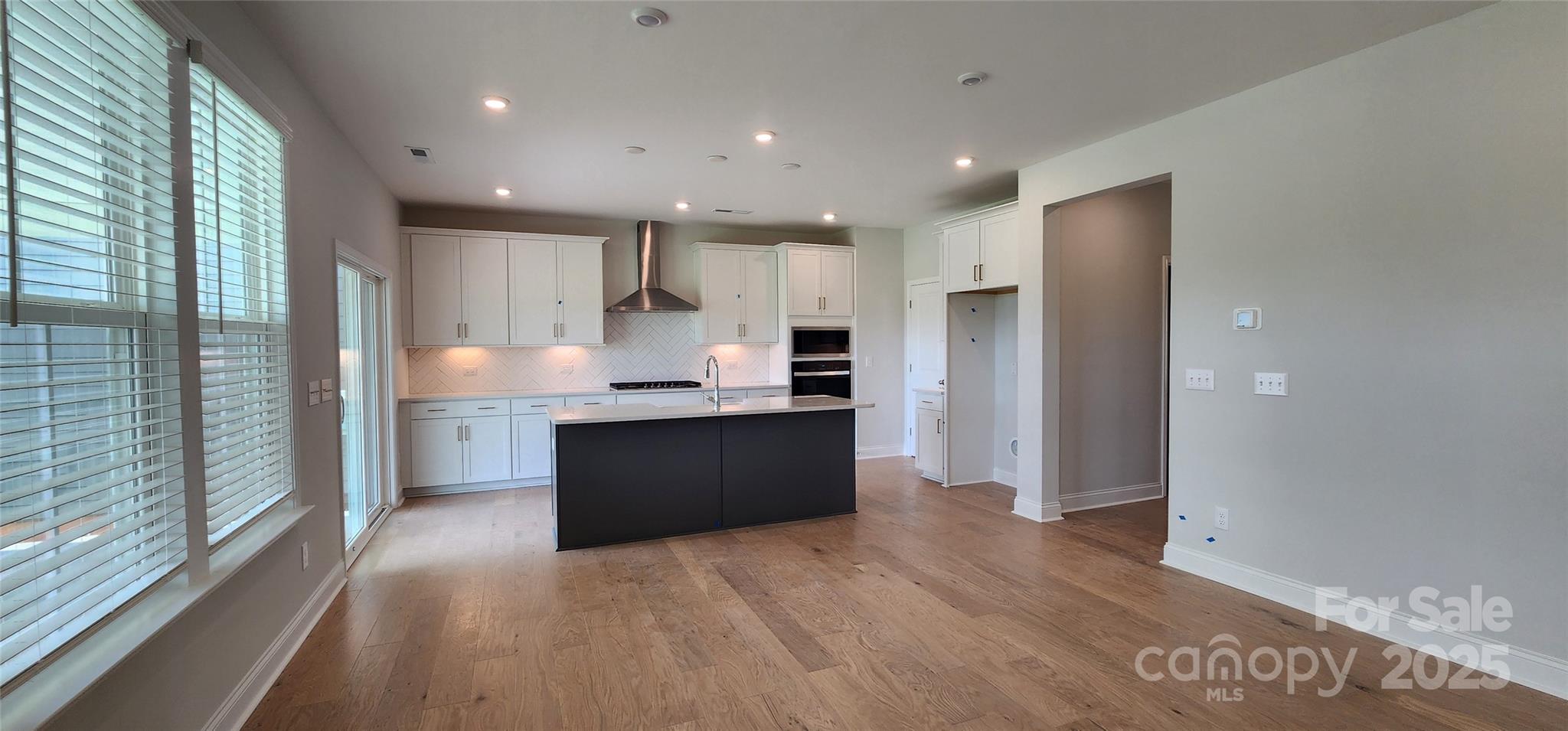 885 Regulus Court York, SC 29745 - Photo 12 of 46 a large kitchen with a large window and stainless steel appliances