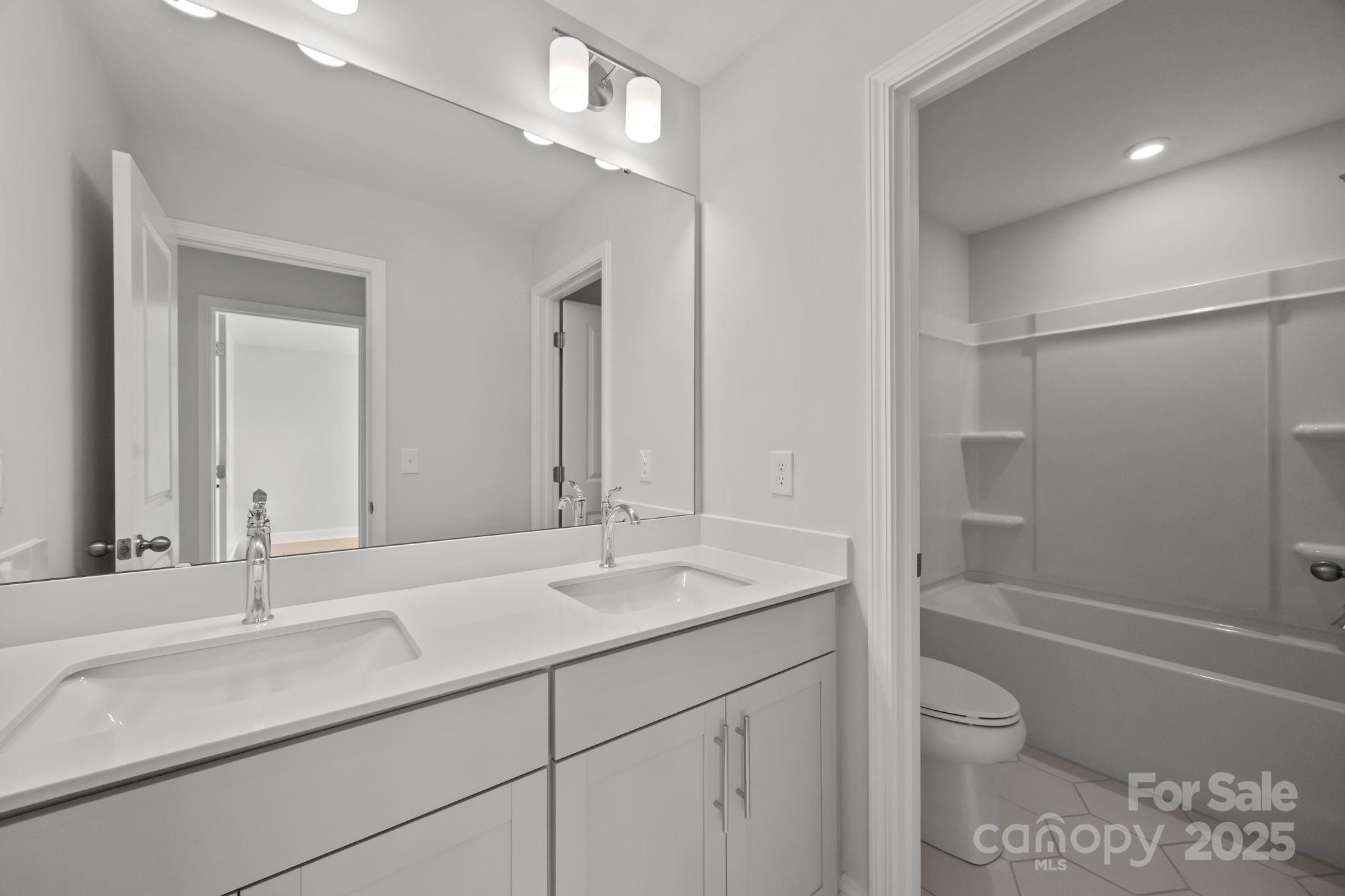 885 Regulus Court York, SC 29745 - Photo 27 of 46 a bathroom with a sink a toilet and shower