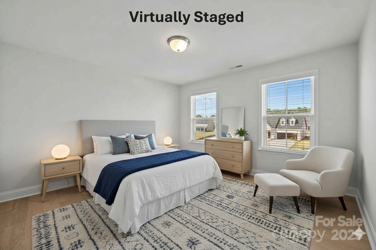 885 Regulus Court York, SC 29745 - Photo 28 of 46 a bedroom with a bed and a couch