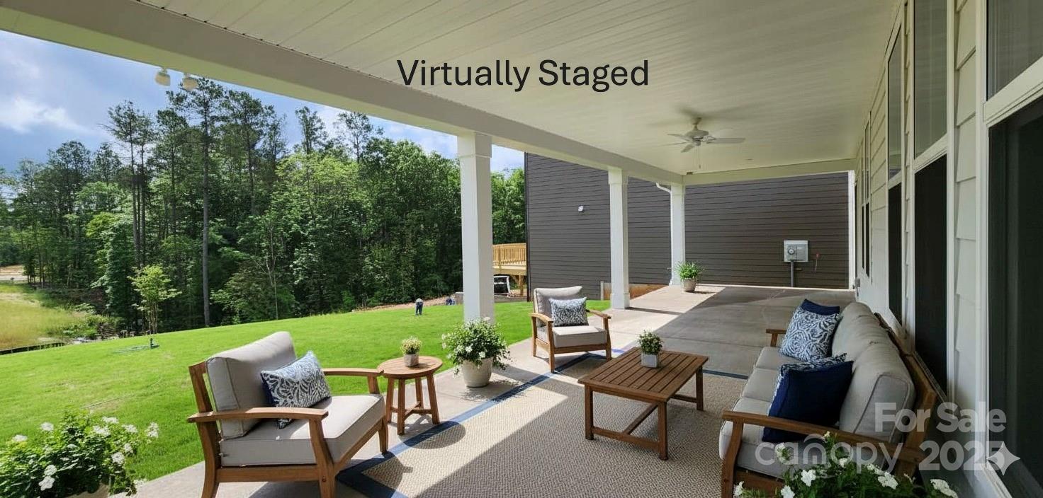 885 Regulus Court York, SC 29745 - Photo 35 of 46 a view of a patio with couches table and chairs and potted plants