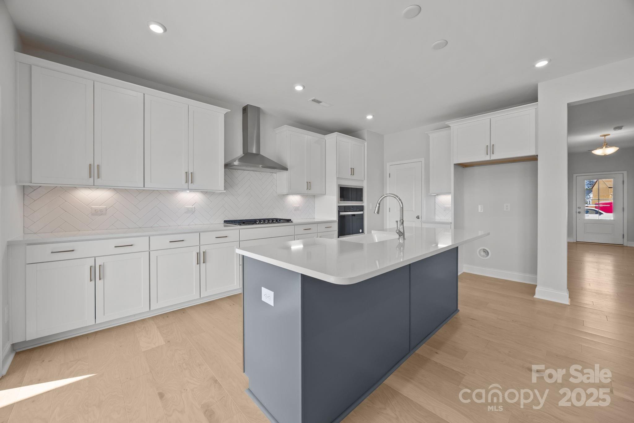 885 Regulus Court York, SC 29745 - Photo 9 of 46 a kitchen with white cabinets appliances and sink