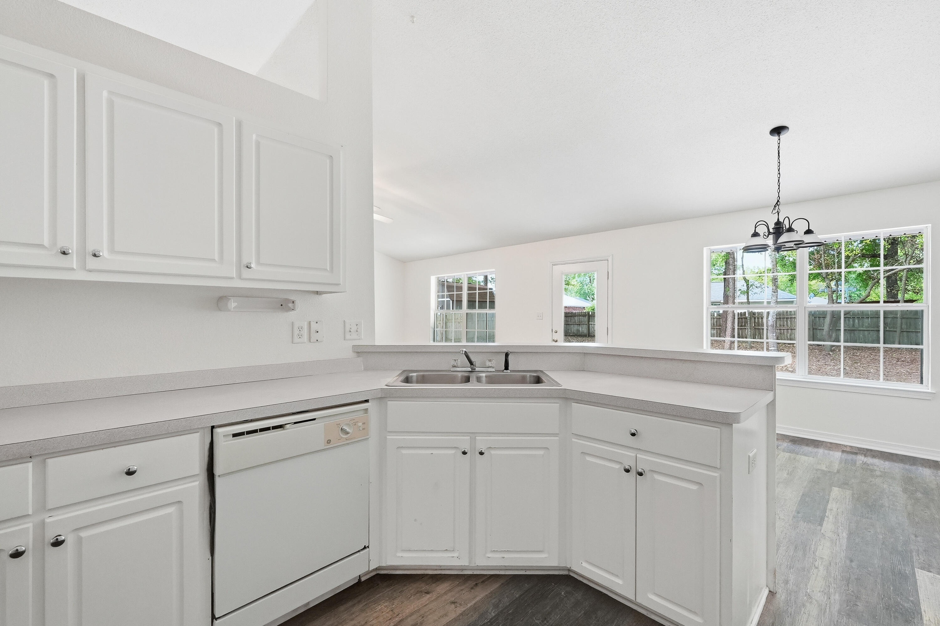 4087 Audiss Road Milton, FL 32583 - Photo 18 of 34 a kitchen with white cabinets and sink