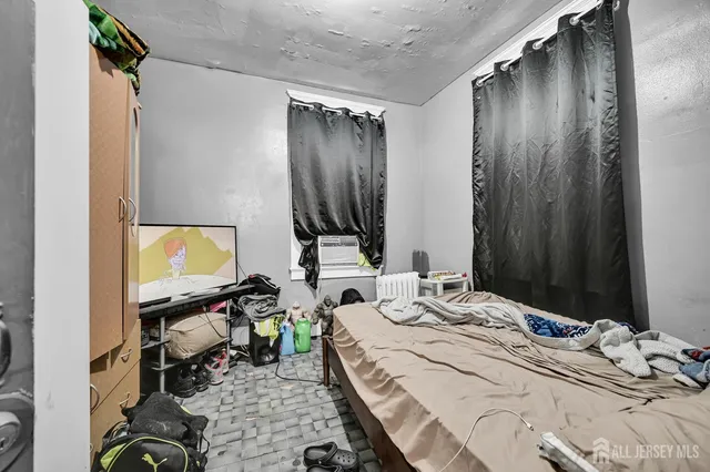 a kitchen with stainless steel appliances kitchen island granite countertop a refrigerator a sink dishwasher a dining table and chairs with white cabinets