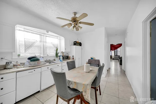 a bedroom with a bed and cabinets