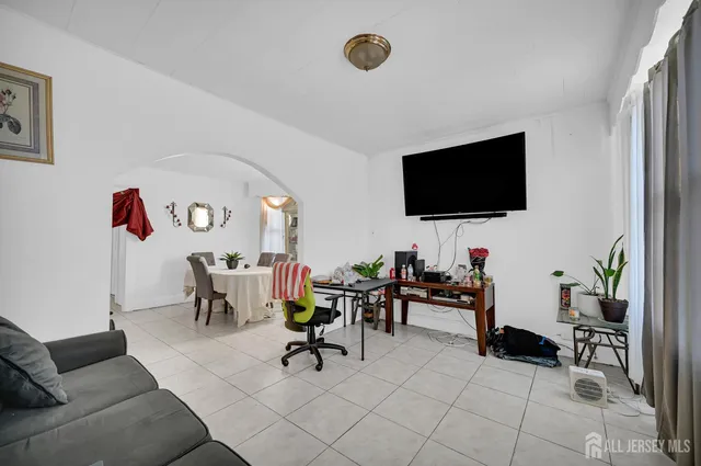 a living room with furniture and a table