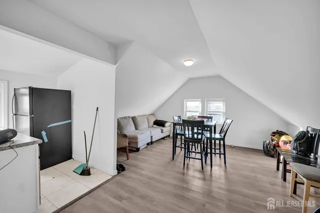 a room with furniture a washer and dryer