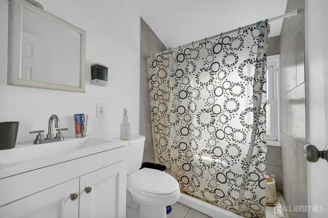 a bedroom with two beds and a couch