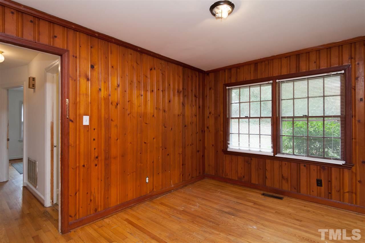 3105 Brentwood Road Raleigh, NC 27604 - Photo 13 of 25 a view of an empty room with wooden floor and a window