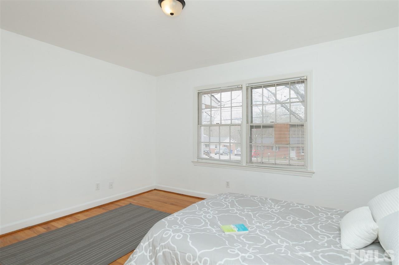 3105 Brentwood Road Raleigh, NC 27604 - Photo 16 of 25 a bedroom with a bed and a window