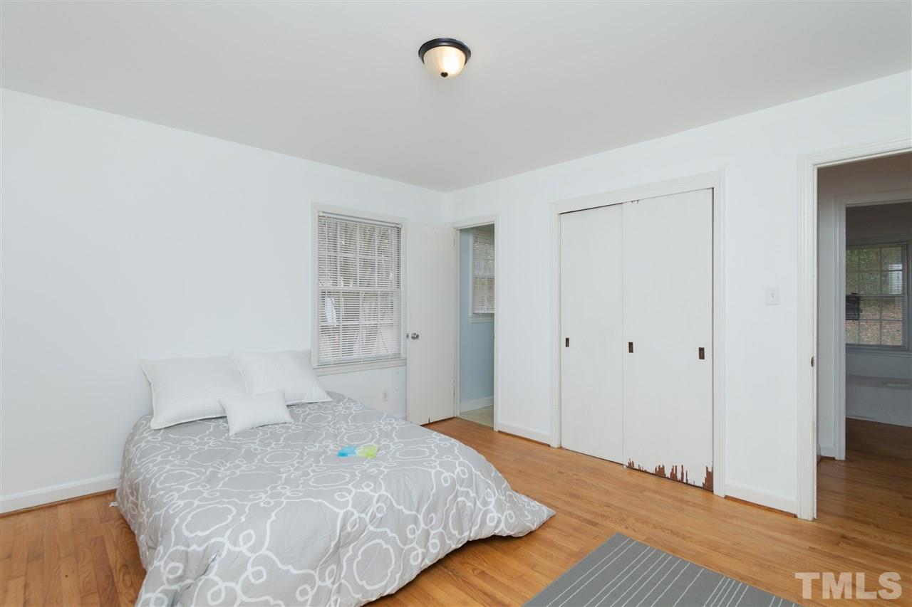 3105 Brentwood Road Raleigh, NC 27604 - Photo 19 of 25 a bedroom with a bed and a window
