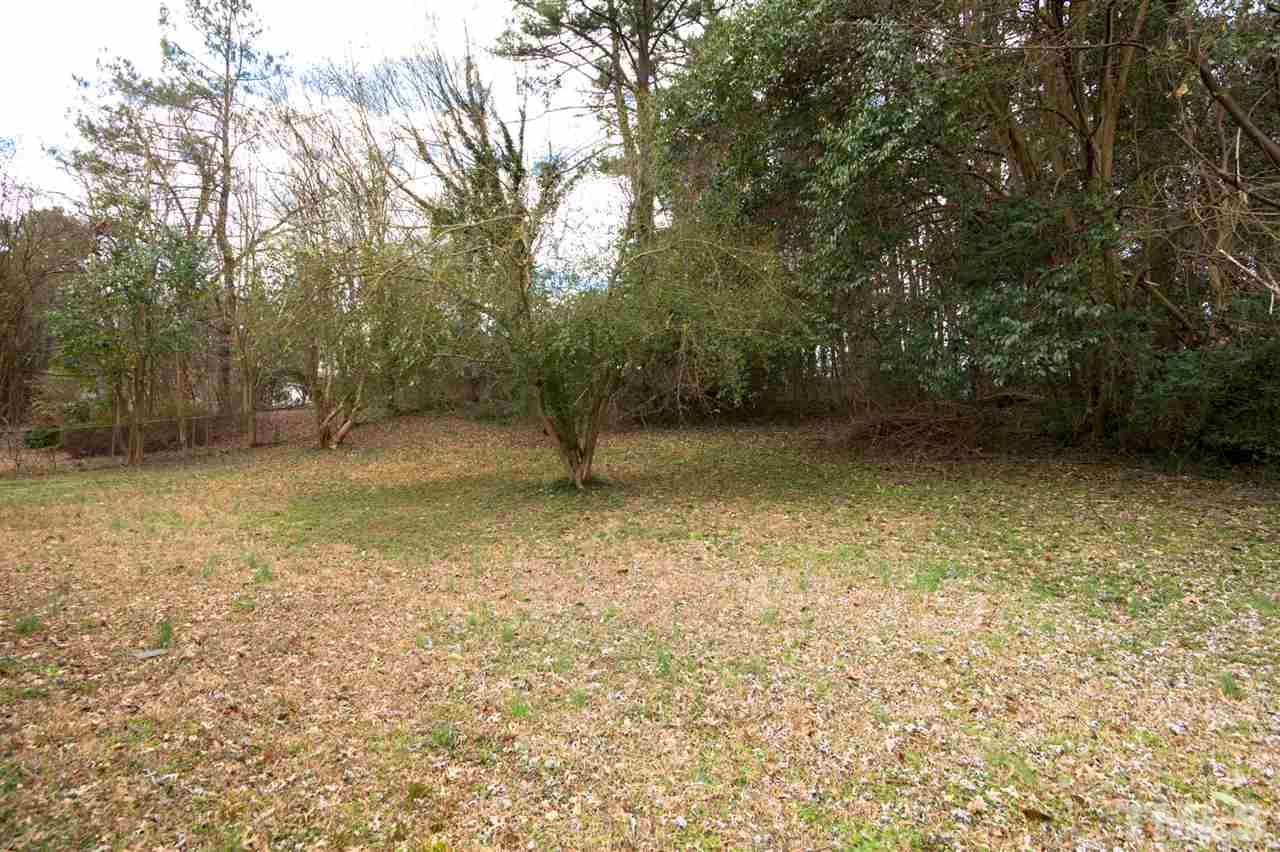 3105 Brentwood Road Raleigh, NC 27604 - Photo 24 of 25 a view of a yard with a tree