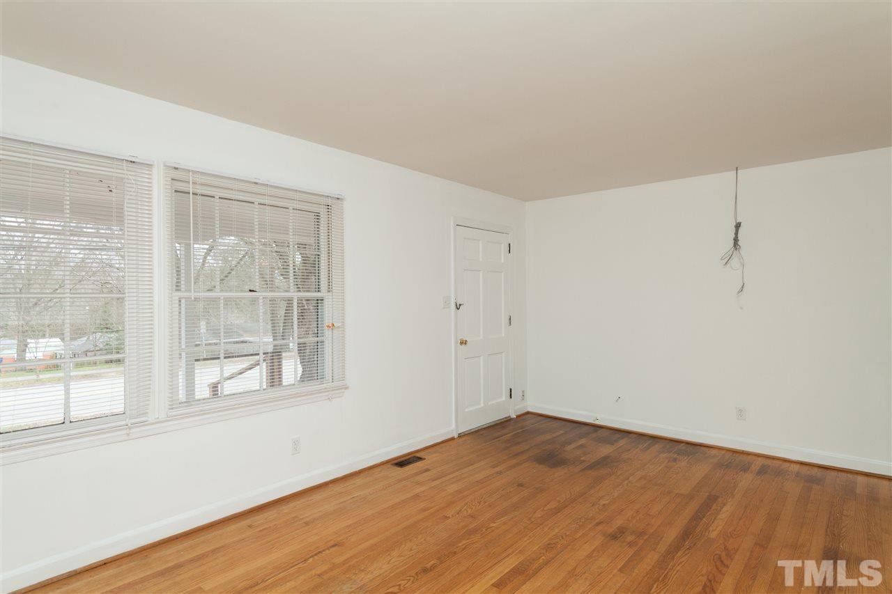 3105 Brentwood Road Raleigh, NC 27604 - Photo 7 of 25 a view of empty room with wooden floor and fan